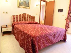 Postel nebo postele na pokoji v ubytování Hotel Euro Quiris