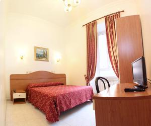 Postel nebo postele na pokoji v ubytování Hotel Euro Quiris