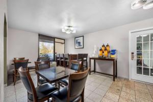 a dining room with a table and chairs at Days Inn by Wyndham Raleigh Midtown in Raleigh +25 photos