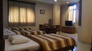 Postel nebo postele na pokoji v ubytování Hotel 678 Kemang Powered By Cocotel