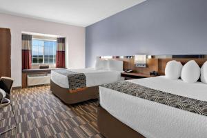 Postel nebo postele na pokoji v ubytování Microtel Inn & Suites by Wyndham Sweetwater