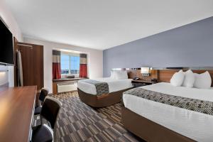 Postel nebo postele na pokoji v ubytování Microtel Inn & Suites by Wyndham Sweetwater
