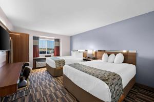 Postel nebo postele na pokoji v ubytování Microtel Inn & Suites by Wyndham Sweetwater