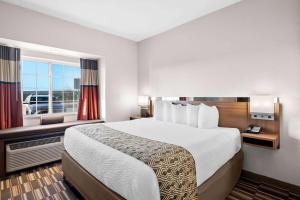 Postel nebo postele na pokoji v ubytování Microtel Inn & Suites by Wyndham Sweetwater