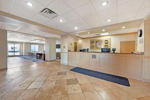 an office lobby with a waiting area and a desk at Comfort Inn & Suites Rawlins in Rawlins