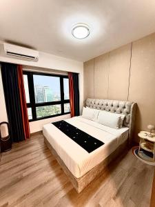 Postel nebo postele na pokoji v ubytování Agile TRX Luxury suite Bukit bintang