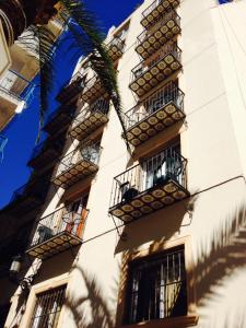 a building with balconies on the side of it at Hotel Queens - Adults Only in Benidorm