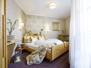 Posteľ alebo postele v izbe v ubytovaní Boutique Hotel Montanara