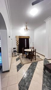 a dining room with a table and chairs at Masa House Luxor in Luxor +43 photos