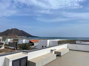 a view of the ocean from the roof of a building at Beach House in Calhau