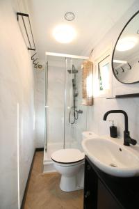a bathroom with a toilet and a sink and a shower at KD 808 - Vakantiepark Kijkduin in The Hague