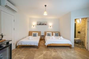 Ένα ή περισσότερα κρεβάτια σε δωμάτιο στο Boti Butik Otel