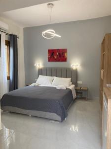 a bedroom with a large bed in a room at Cosy studio 2 in Stoupa in Stoupa