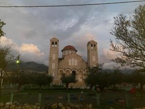 a large building with two towers on top of it at Cosy studio 2 in Stoupa in Stoupa