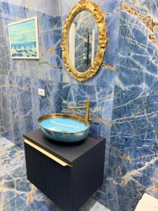a bathroom with a sink and a mirror at Relax assoluto in Cremona