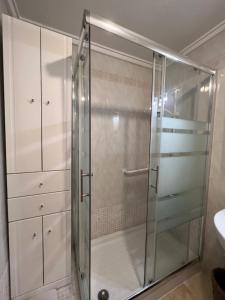 a shower with a glass door in a bathroom at Casa del Sombrero Los Locos beach in Torrevieja +16 photos