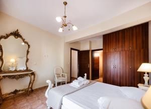 Posteľ alebo postele v izbe v ubytovaní Villa Galini