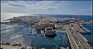 an aerial view of a harbor with boats in the water at White Sand in Gallipoli