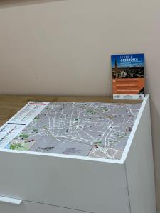 a map on top of a white drawer at Relax assoluto in Cremona
