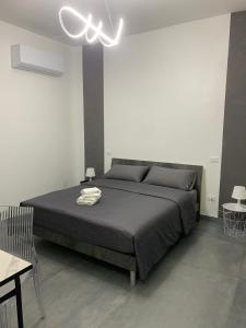 a bedroom with a bed and a ceiling fan at Charm Room 22 in Termoli