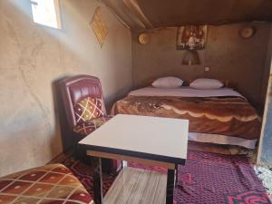 Postel nebo postele na pokoji v ubytování Camel House camp