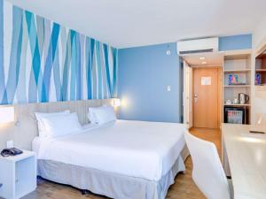 Cama o camas de una habitación en Mercure Rio de Janeiro Barra da Tijuca