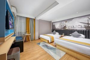 Ένα ή περισσότερα κρεβάτια σε δωμάτιο στο Lanyu Hotel-Guangzhou YongQingFang Tourist Scenic Spot Branch-Airport pick-up service