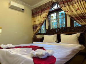 Postel nebo postele na pokoji v ubytování Lotus Blanc Homestay