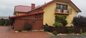 a house with graffiti on the side of it at Noclegi U Waldiego in Starachowice