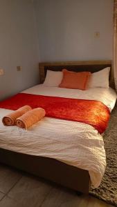 a bedroom with two beds with towels on them at Vineyard Kerugoya in Keruguya