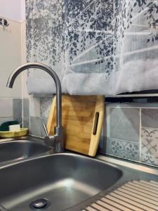 a kitchen sink with a towel hanging over it at Vineyard Kerugoya in Keruguya +21 photos