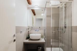 a bathroom with a sink and a shower at Dimora Capuleti in Venice +62 photos