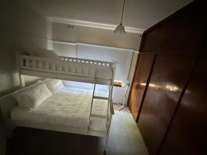 a white bunk bed in a small room at The Granth - your perfect river escape in Cobram