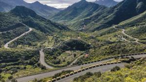 an aerial view of a mountain road with a train at El Pequeño Refugio - C in Chío