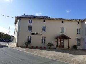 a white building on the side of a street at Hotel Central in Chaunay
