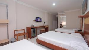 Voodi või voodid majutusasutuse Hotel Genova Centro toas