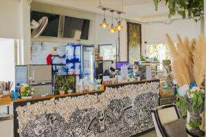 a store with a counter with a floral pattern at White House Beach Camping Caravans in Ban Thai Don (2)