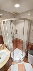 a bathroom with a shower and a sink at Edificio Torpa in Benidorm