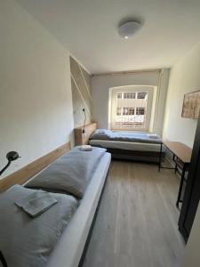 Postel nebo postele na pokoji v ubytování Hildesheim Pepperworth