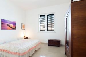 Postel nebo postele na pokoji v ubytování Casa vacanze in Salento per famiglie