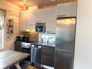 Nhà bếp/bếp nhỏ tại Villa Huvilla - 6+2 henkilölle, Himos Areenan alue, 80m²