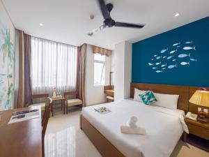 Postelja oz. postelje v sobi nastanitve Doha Central Bliss Danang Hotel by Haviland