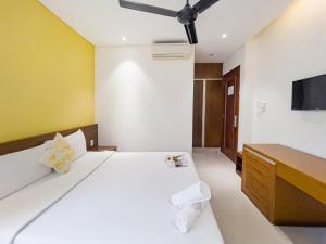 Postelja oz. postelje v sobi nastanitve Doha Central Bliss Danang Hotel by Haviland