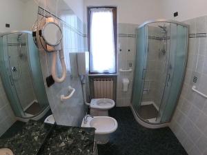a bathroom with a toilet and a shower and a sink at Apartment Superior 950 Meters From The Sea in Albisola Superiore +15 photos