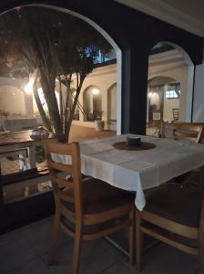 a table with a white table cloth on it at Terrace Sands Guesthouse in Durban
