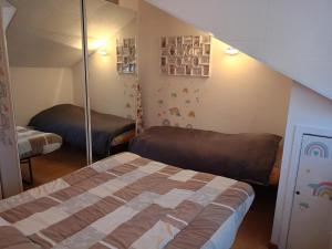 a bedroom with a bed and a mirror at Ale Sweet Home in Piossasco +13 photos