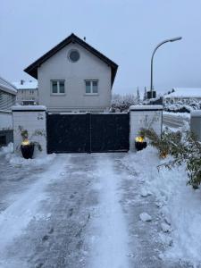 a house with a fence in the snow at Casa Brocktega in Bestwig