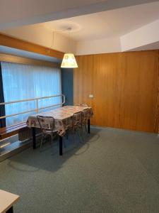 a dining room with a table and chairs at Residence Solaria, Albarè, Marilleva 1400 in Marilleva