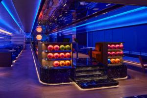 a bowling alley with a bunch of apples on display at InterContinental Taichung by IHG in Taichung