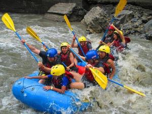 a group of people rafting in a river at Finca Jerusalen in Tobia